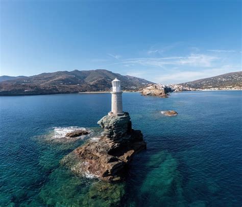 Premium Photo | Greece andros island the stone beacon on a rock aerial view chora town cape