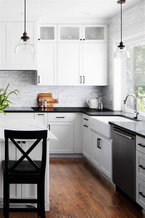 Dark Wood Floor White Shaker Cabinets Black Granite Countertops Marble Backsplash | Black ...