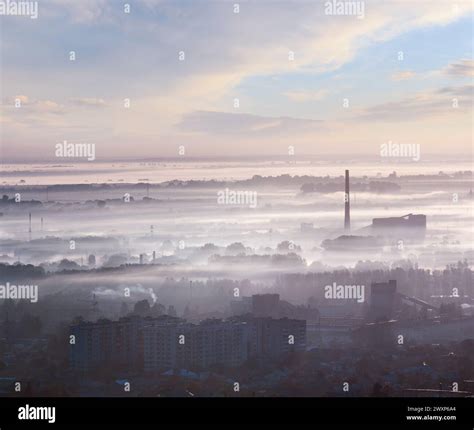 Morning Lviv City (Ukraine) outskirts view from "High Castle" Hill (in first sun rays back ...