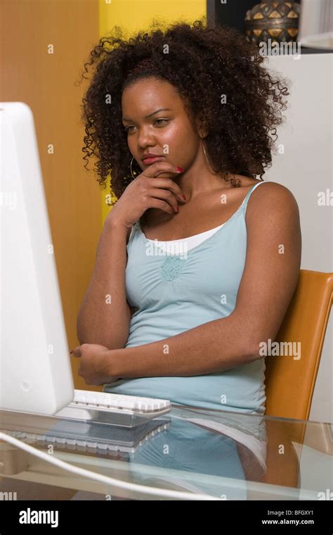 Young Woman Using Desktop Computer Stock Photo - Alamy