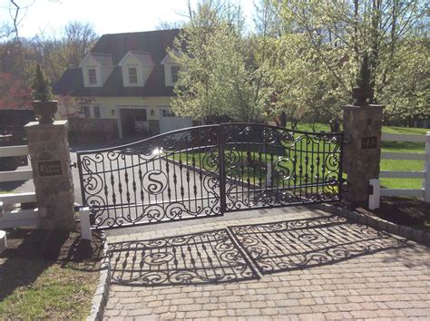 Iron Driveway Gates with custom stone pillars and paver detail on drive. Stone Pillars, Custom ...