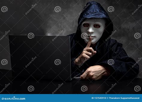 Male Hacker Hidden Face with the Mask and Hoodie. Obscured Dark Face Making Silence Gesture Try ...