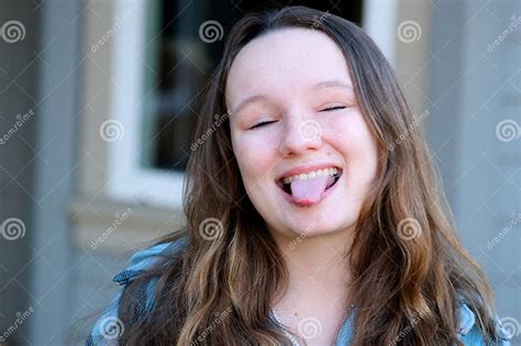 Sassy Kid Shows Her Silly Side by Posing with a Tongue Out and Funny ...