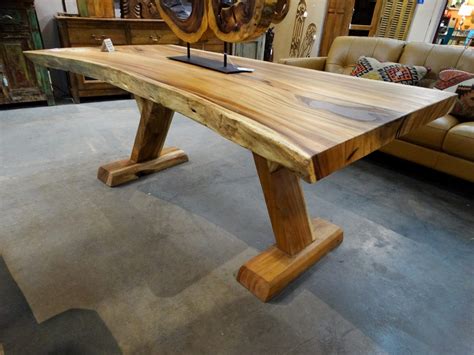 Wood Dining Table with Wood Legs features a rustic farmhouse look.