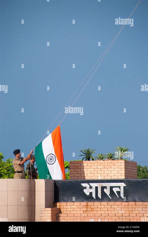 Raising the Flag at the Wagah Border Flag Ceremony Stock Photo - Alamy