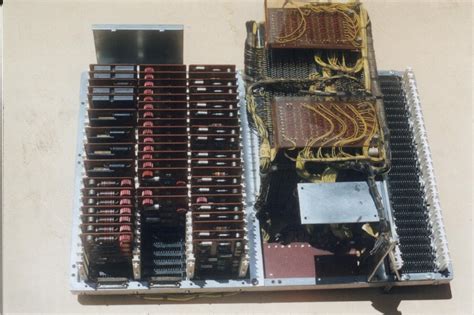 Examining the core memory module inside a vintage IBM 1401 mainframe