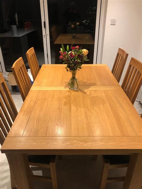 Solid oak dining table and chairs | in Hazel Grove, Manchester | Gumtree