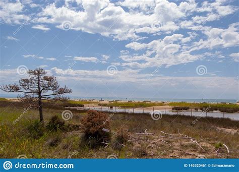 Bibione Beach stock image. Image of fence, clouds, bibione - 146320461
