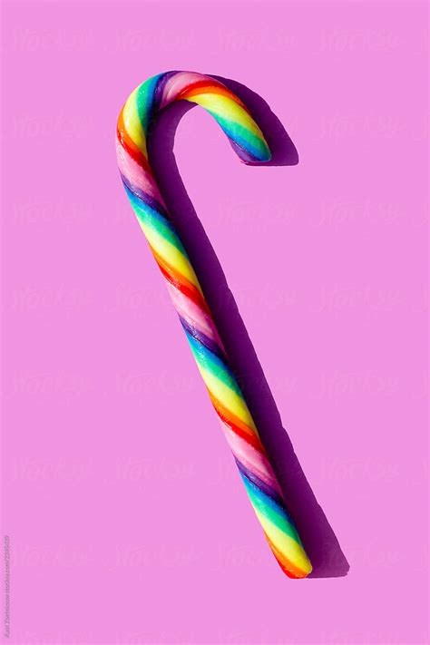 "Simple Still-life Of A Rainbow-colored Candy Cane On A Light Magenta ...