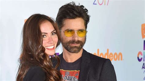 John Stamos gets engaged to Caitlin McHugh at Disneyland - ABC News