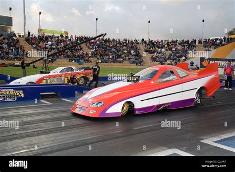 two drag racing cars line up ready to race at the track Stock Photo - Alamy