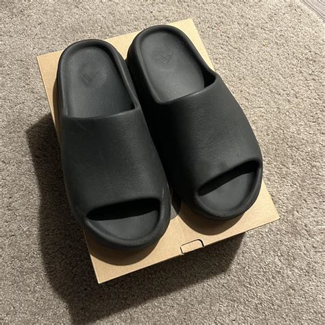 Yeezy Slides - Black Looking to get rid of these... - Depop