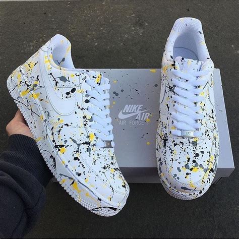 The pair of sneakers Nike's Customized Air Force 1 Paint Splash on the ...