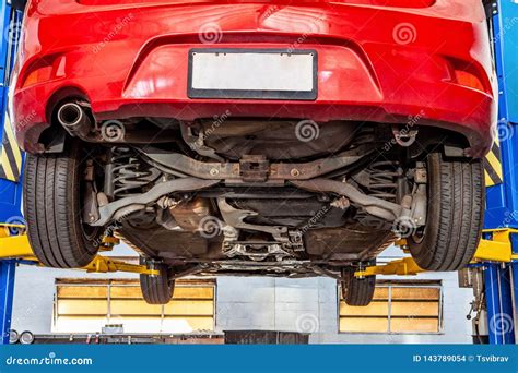 Vehicle Lifted on Hydraulic Car Lift. Stock Photo - Image of chassis, routine: 143789054