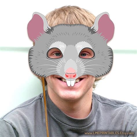 a man wearing a rat mask with his face painted to look like he's smiling