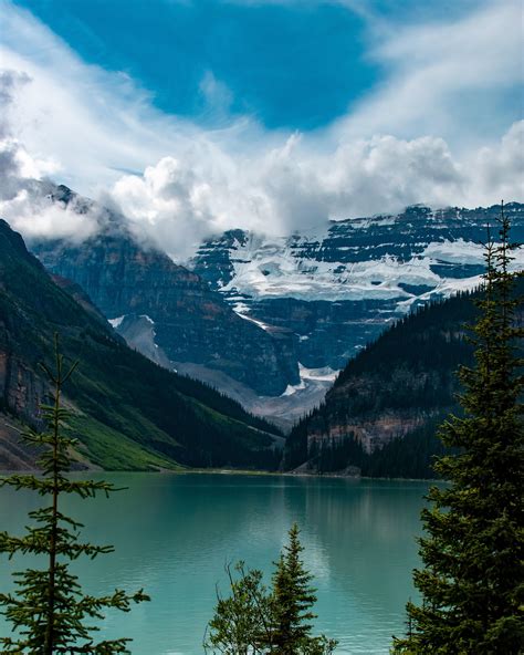 Midday Lake Louise in Banff, Alberta [4000x5000] [OC] : r/EarthPorn