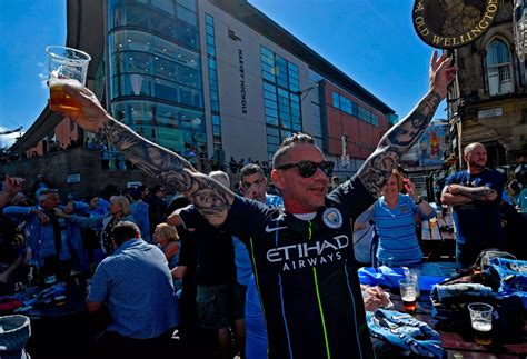 Fans celebrate Manchester City's historic treble - in pictures ...