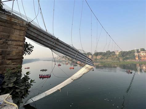 Photos, videos show moment suspension bridge collapsed in India, leaving survivors clinging to ...