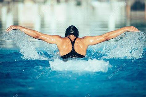 Professional swimmer performing butterfly stroke Stock Photo by ...