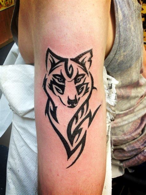 beautiful back tattoos | Small wolf tattoo, Tribal tattoos, Wolf tattoos for women