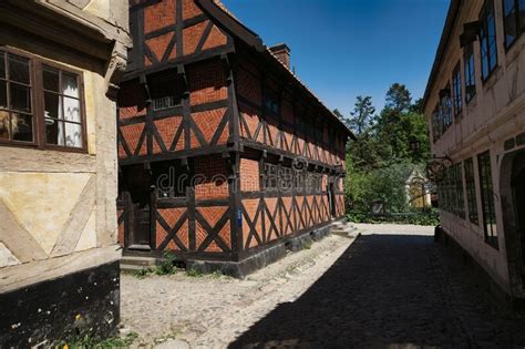 Scene of the Street with Buildings of the Den Gamle by Museum Surrounded by Trees in Aarhus ...