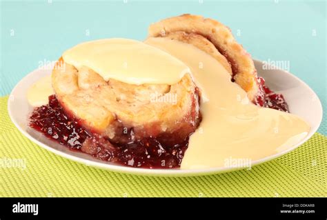 JAM ROLY POLY DESSERT WITH CUSTARD Stock Photo - Alamy