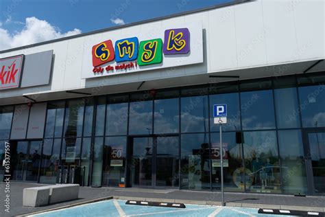 Smyk store with logo sign. Polish retail chain shop, selling products for infants and children ...