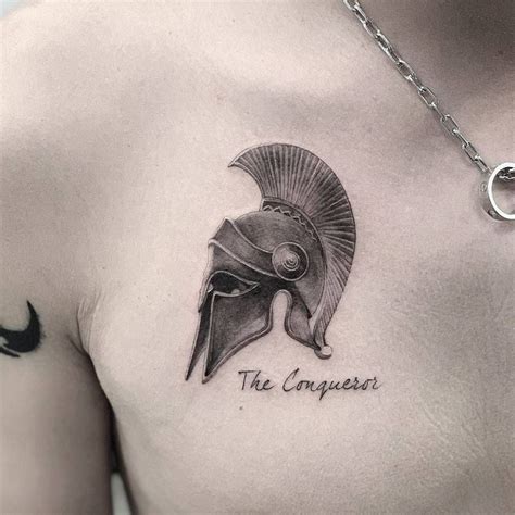 Single needle Spartan helmet tattoo on the chest. Warrior Tattoos ...