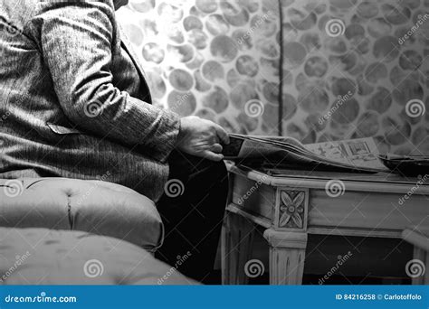 Old man reading newspaper stock photo. Image of time - 84216258