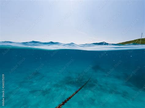 Underwater view of an anchor chain of a ship. Stock Photo | Adobe Stock