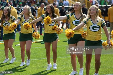 Green Bay Packer cheerleaders cheer during a game between the Green ...