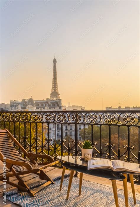 beautiful paris balcony at sunset with eiffel tower view Stock Photo ...