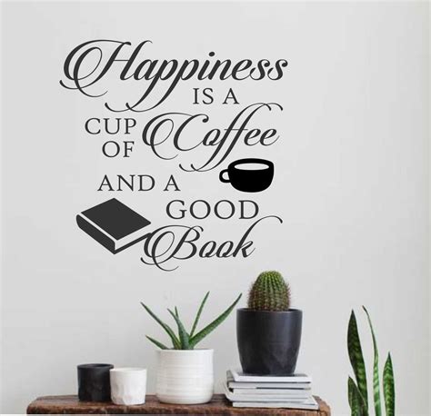 a wall decal that says happiness is a cup of coffee and a good book