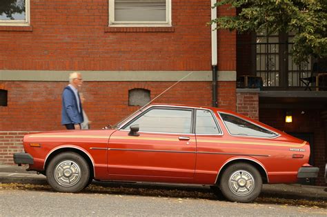 OLD PARKED CARS.: 1979 Datsun 210.