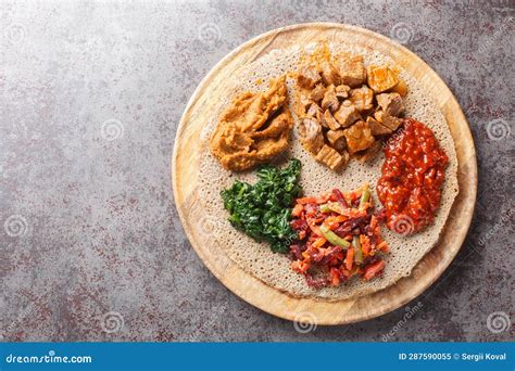 Ethiopian Injera Topped with Meat, Vegetables, Greens Close Up on the ...