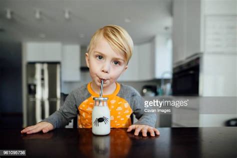 Small Boy Drinking Milk From Bottle Photos and Premium High Res Pictures - Getty Images