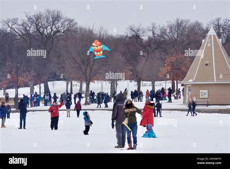 Lake Harriet Winter Kite Festival on frozen lake, in January. Fun ...