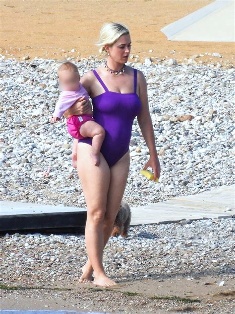 Katy Perry stuns in purple swimsuit as she hits the beach with fiancé ...