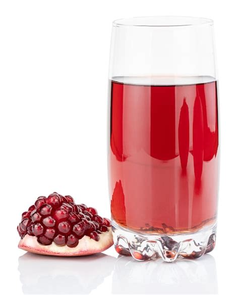 Premium Photo | Pomegranate juice with pomegranate isolated on a white ...