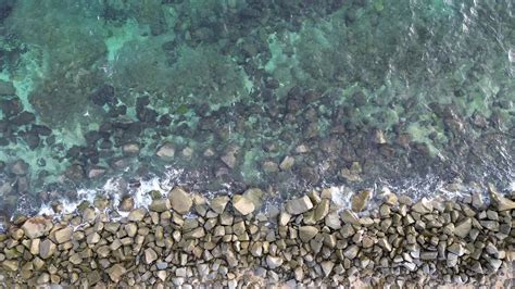 aerial view of pebble beach with blue sea 31708075 Stock Video at Vecteezy