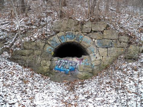 Entrance to an abandoned limestone mining tunnel from the late 1800's. Barn Bluff, Red Wing MN ...