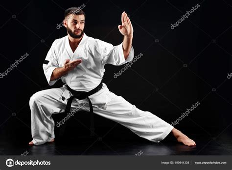 Karate Man Kimono Fighting Stance Black Background Stock Photo by ©amixstudio 199844338