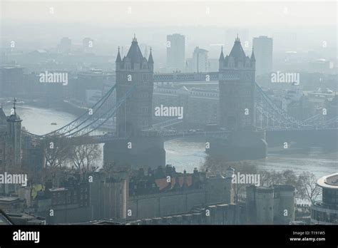 London fog, Tower Bridge and surroundings on a foggy morning, London England United Kingdom UK ...