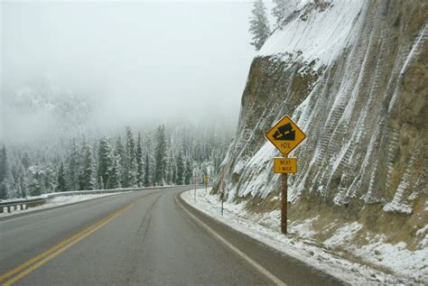 Traffic Signs on Icy Mountain Road Stock Photo - Image of curve, storm: 7248604