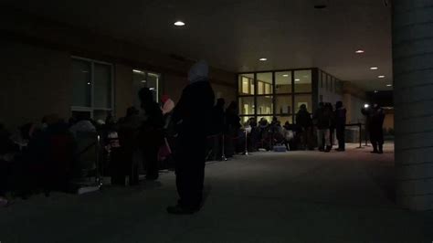 Long line of parents who have waited outside Cardinal Ambrozic school in Brampton all night to ...