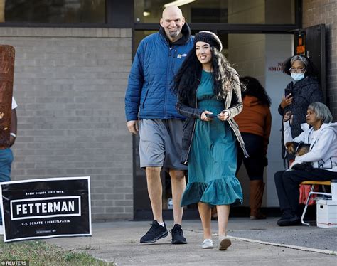 John Fetterman SNUBS reporters as he casts his vote with wife Gisele ...