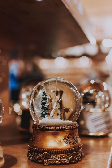 Beautiful vintage snow globe in Christmas market · Free Stock Photo