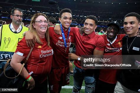 Trent Alexander-Arnold of Liverpool poses with his family after the... News Photo - Getty Images