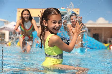 Happy family having fun at water park. Summer vacation Stock Photo | Adobe Stock