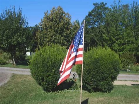 Small American flag waving in a cemetery | Stock Video | Pond5